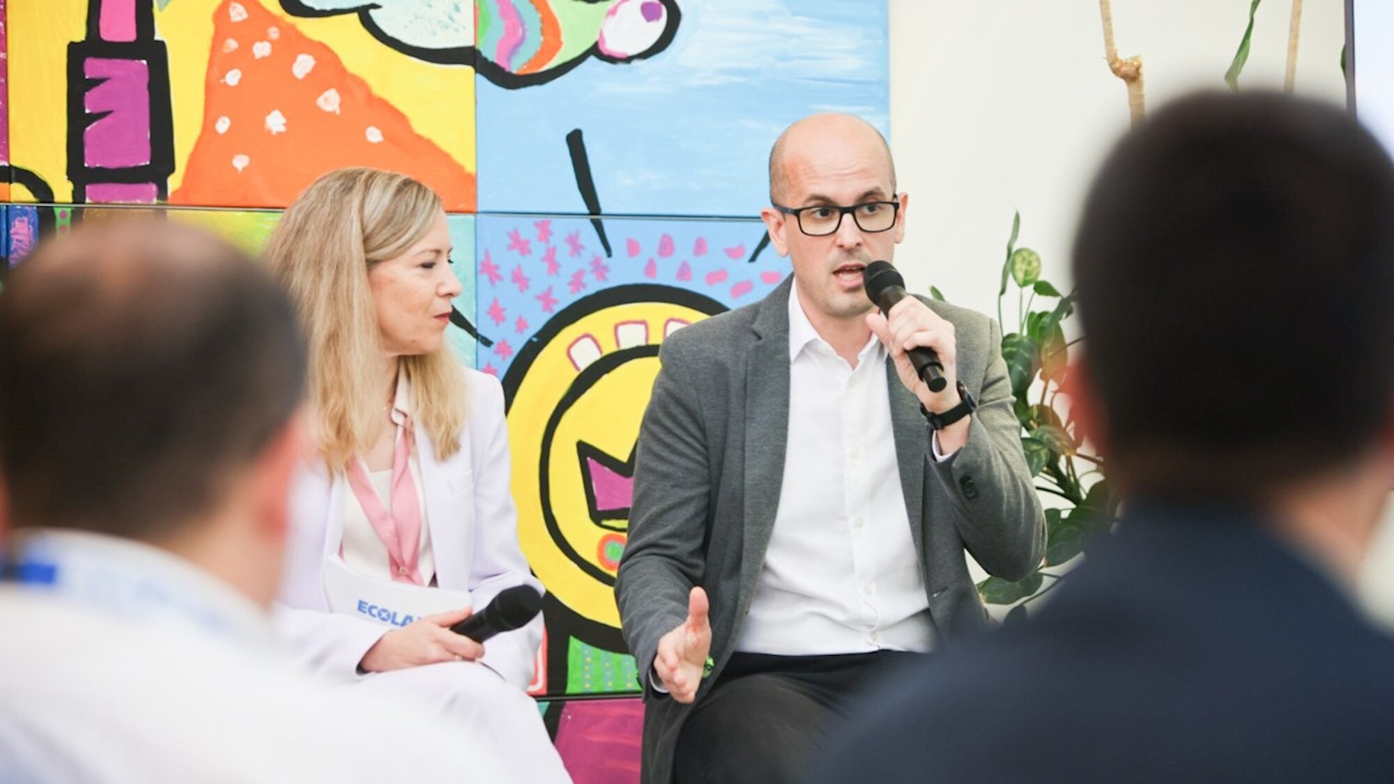 Associates speaking at a panel discussion