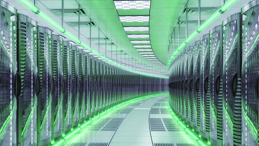 A futuristic data center illuminated with green LED lights, creating a high-tech ambiance.